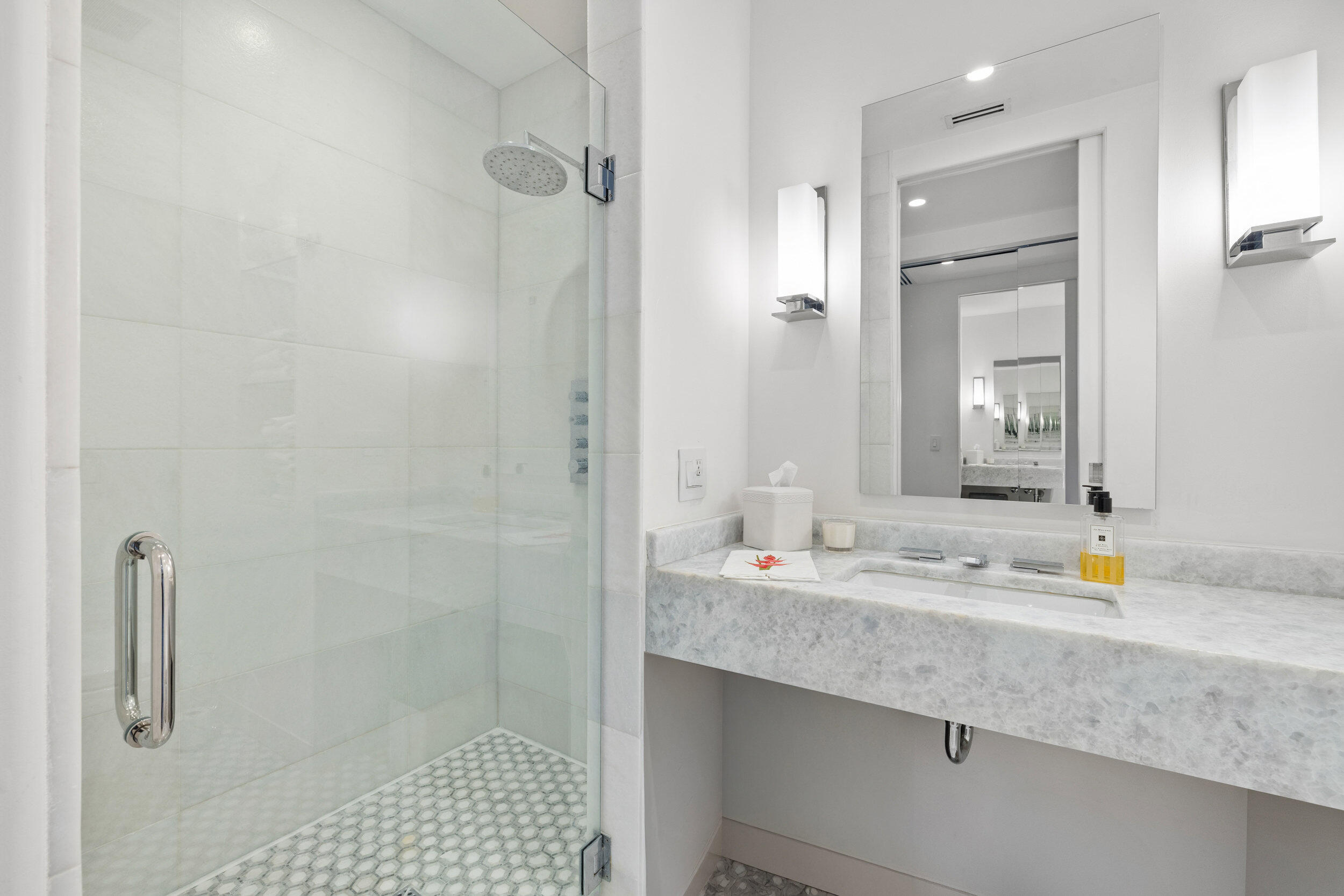 300 South Ocean Boulevard, Unit 3F Palm Beach, FL 33480 - Photo 15 of 27 a bathroom with a sink and a mirror