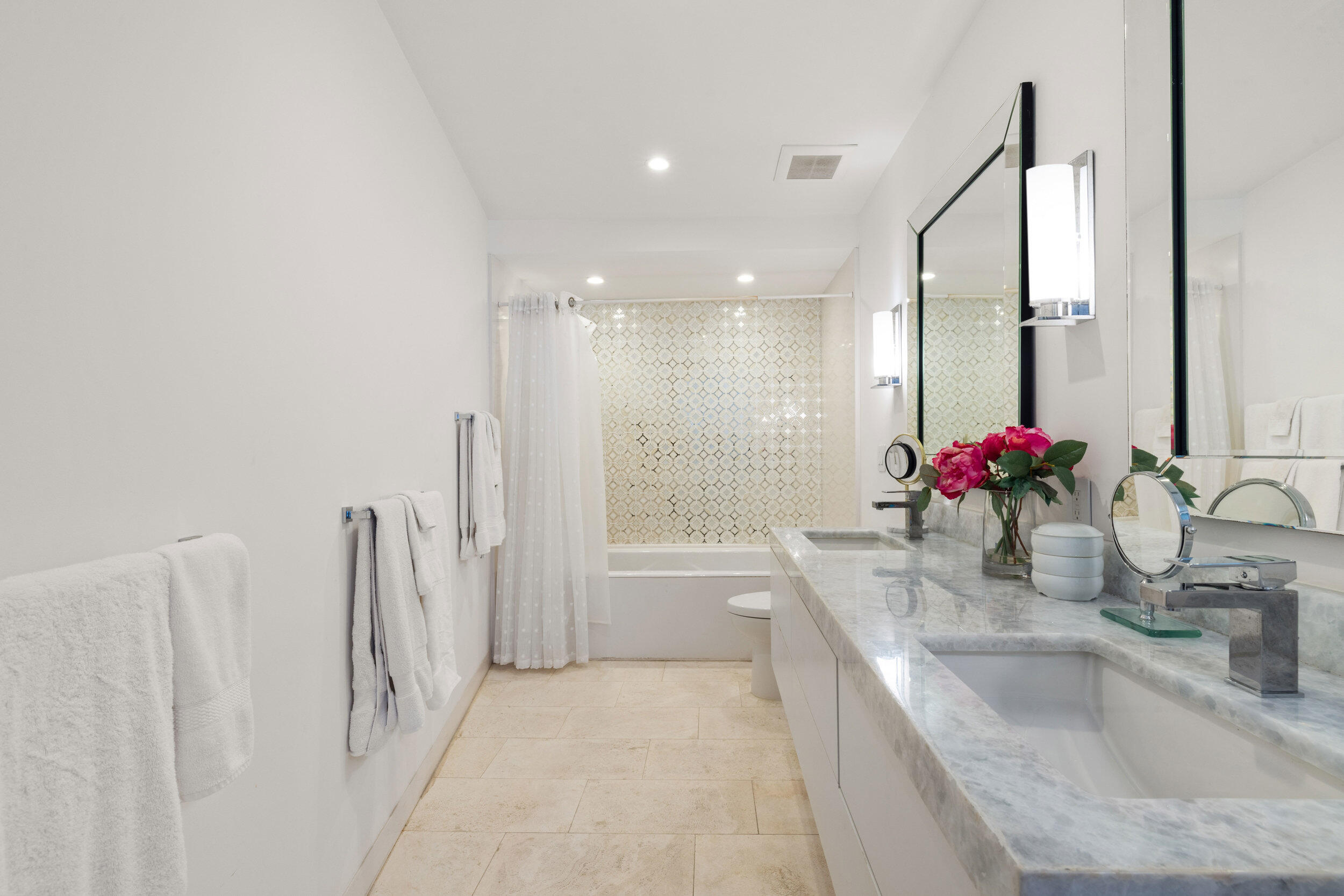 300 South Ocean Boulevard, Unit 3F Palm Beach, FL 33480 - Photo 18 of 27 a bathroom with a granite countertop sink a toilet and a bathtub