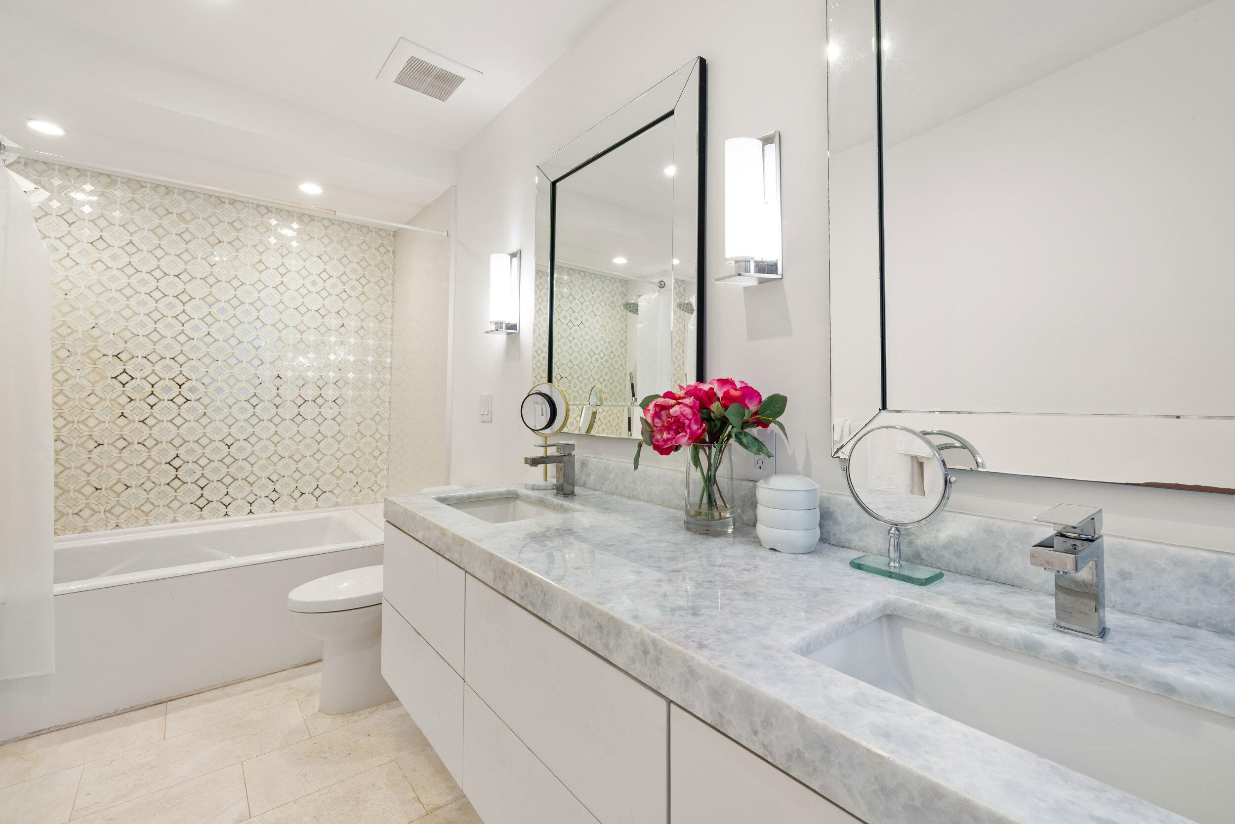 300 South Ocean Boulevard, Unit 3F Palm Beach, FL 33480 - Photo 19 of 27 a bathroom with a granite countertop sink a toilet and shower