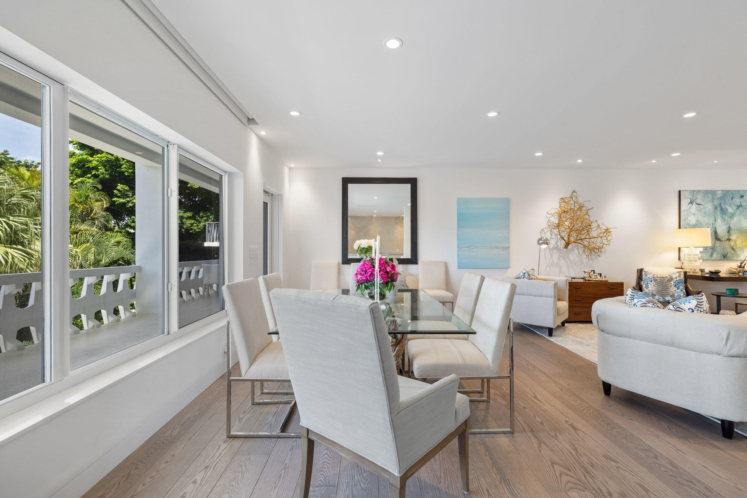 300 South Ocean Boulevard, Unit 3F Palm Beach, FL 33480 - Photo 2 of 27 a view of a dining room with furniture large windows and wooden floor