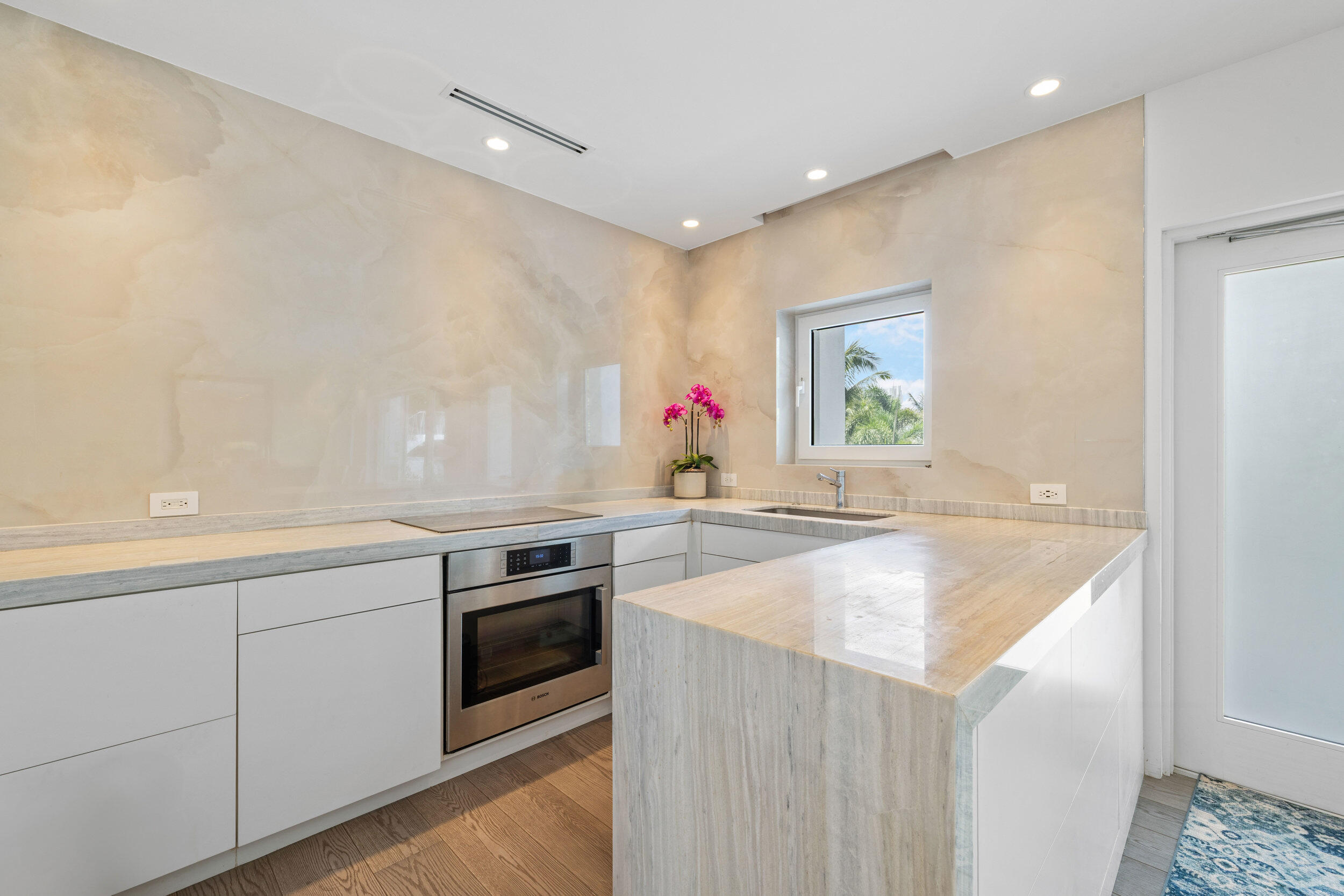 300 South Ocean Boulevard, Unit 3F Palm Beach, FL 33480 - Photo 5 of 27 a kitchen with stainless steel appliances granite countertop a sink and a stove