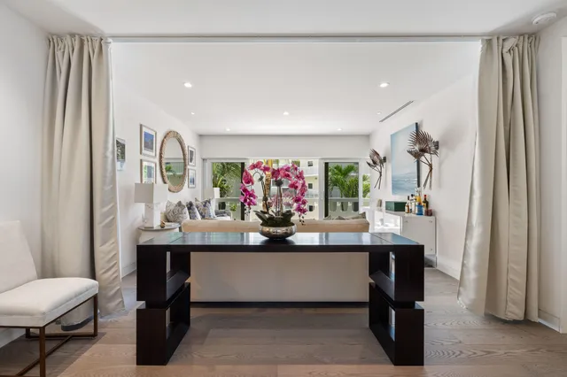 a view of a dining room with furniture and window