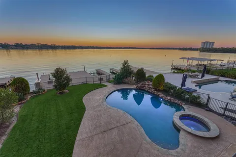 a view of a swimming pool with a patio