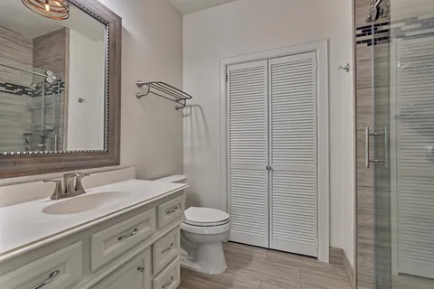 a balcony with furniture and a ceiling fan
