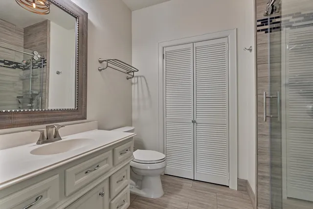 a balcony with furniture and a ceiling fan