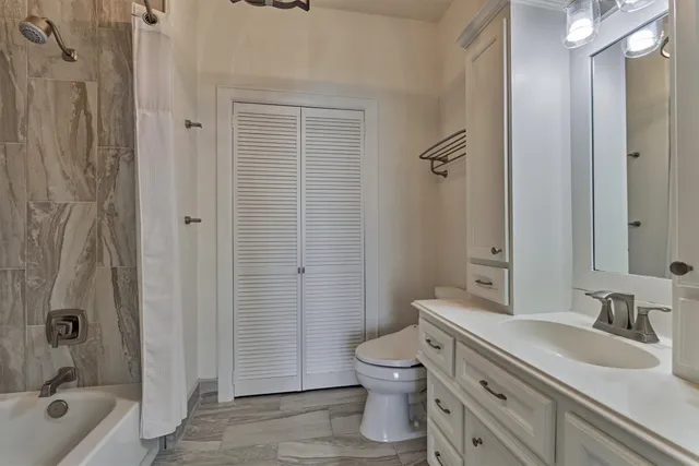 a front view of a house with a lake view