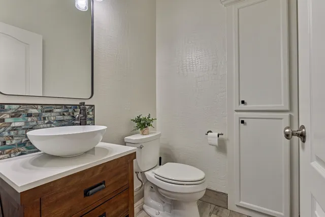 an aerial view of multiple houses with yard