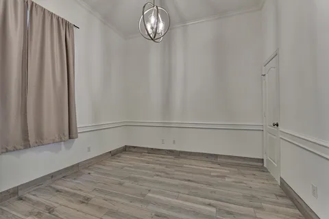 a view of entryway with wooden floor and stairs