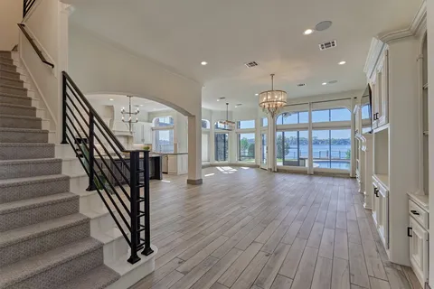 a view of livingroom with furniture wooden floor flat screen tv and window