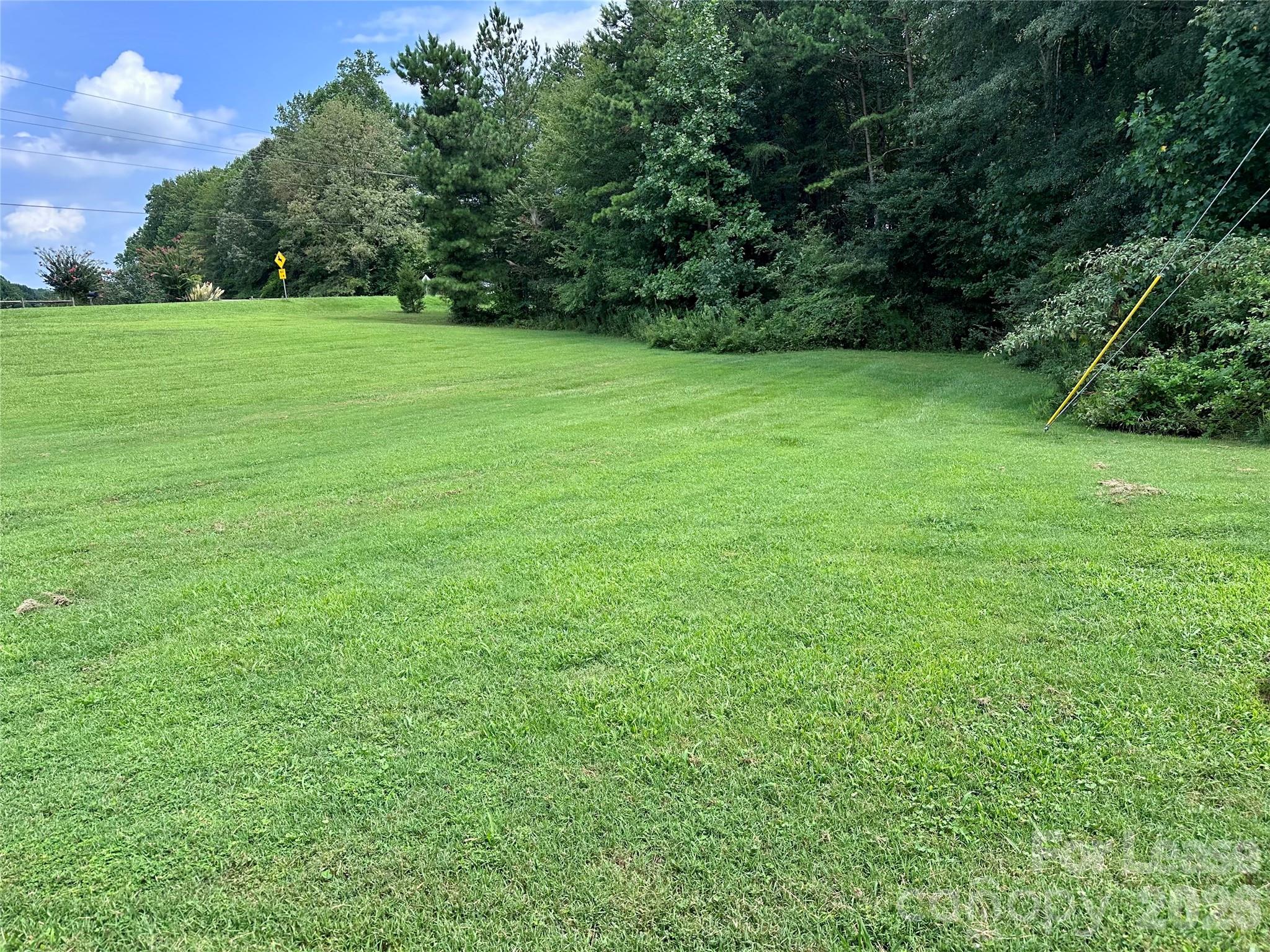 1536 Beth Haven Church Road Denver, NC 28037 - Photo 11 of 11 a view of field with trees in the background