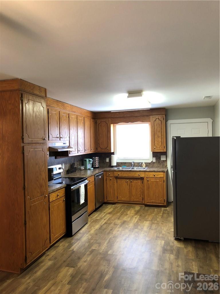 1536 Beth Haven Church Road Denver, NC 28037 - Photo 3 of 11 a kitchen with stainless steel appliances granite countertop a refrigerator and a stove