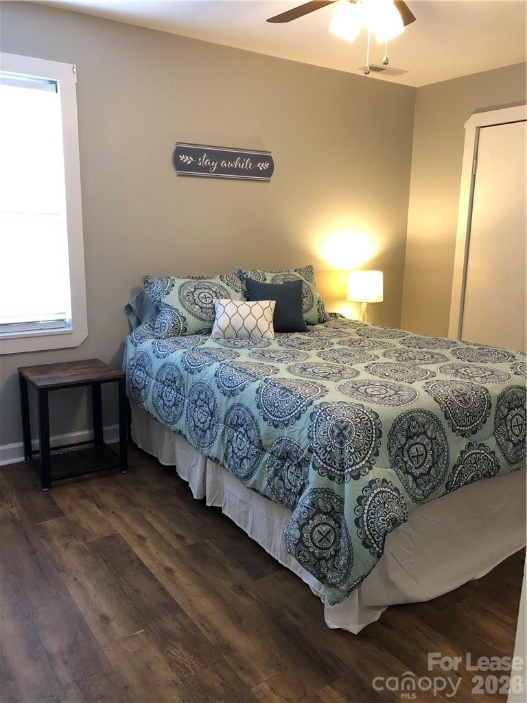 1536 Beth Haven Church Road Denver, NC 28037 - Photo 8 of 11 a bedroom with a bed and a lamp