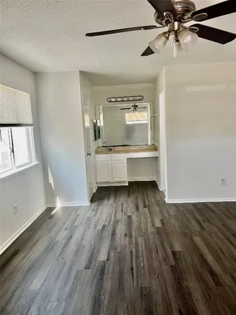 a view of a hardwood floor in a room