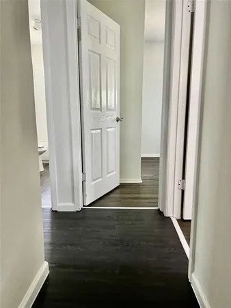 a view of front door with wooden floor