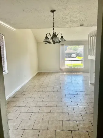 a view of empty room with windows