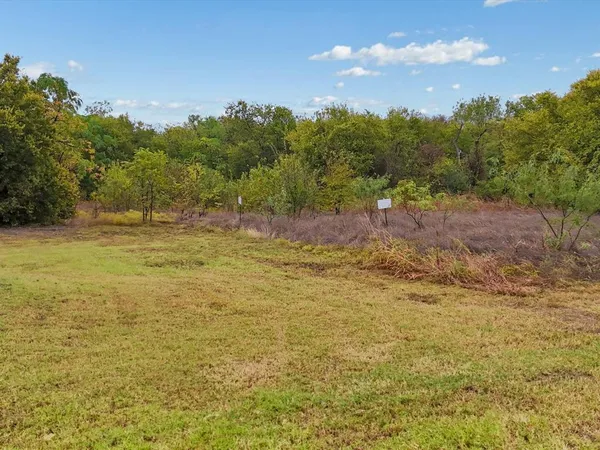 a view of a garden with an outdoor seating