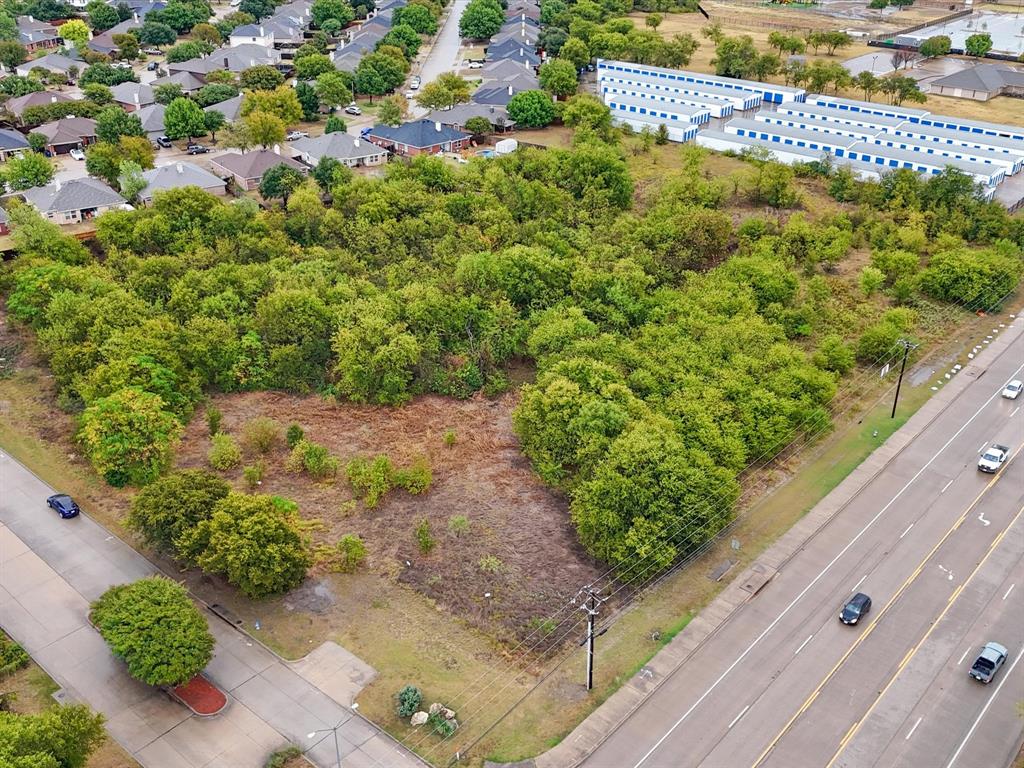 713 South Crowley Road Crowley, TX 76036 - Photo 2 of 24 a view of a garden with a tree