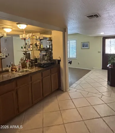 a spacious bathroom with a mirror and a shower