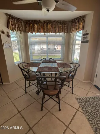 a view of a dining room with furniture and window