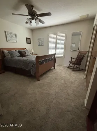 a bedroom with furniture and a window