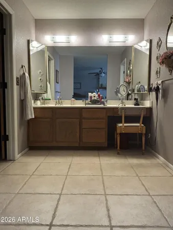 a bathroom with a sink a mirror and a shower