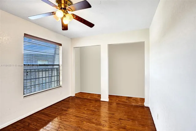 a bathroom with a granite countertop sink toilet mirror and shower