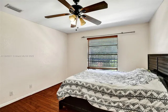 an aerial view of residential houses with outdoor space and ocean