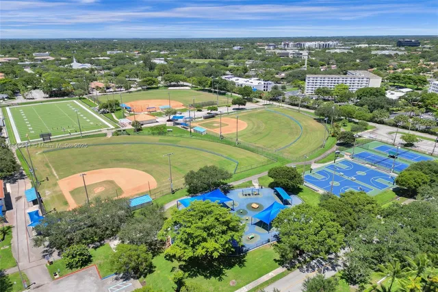 an aerial view of residential houses with outdoor space
