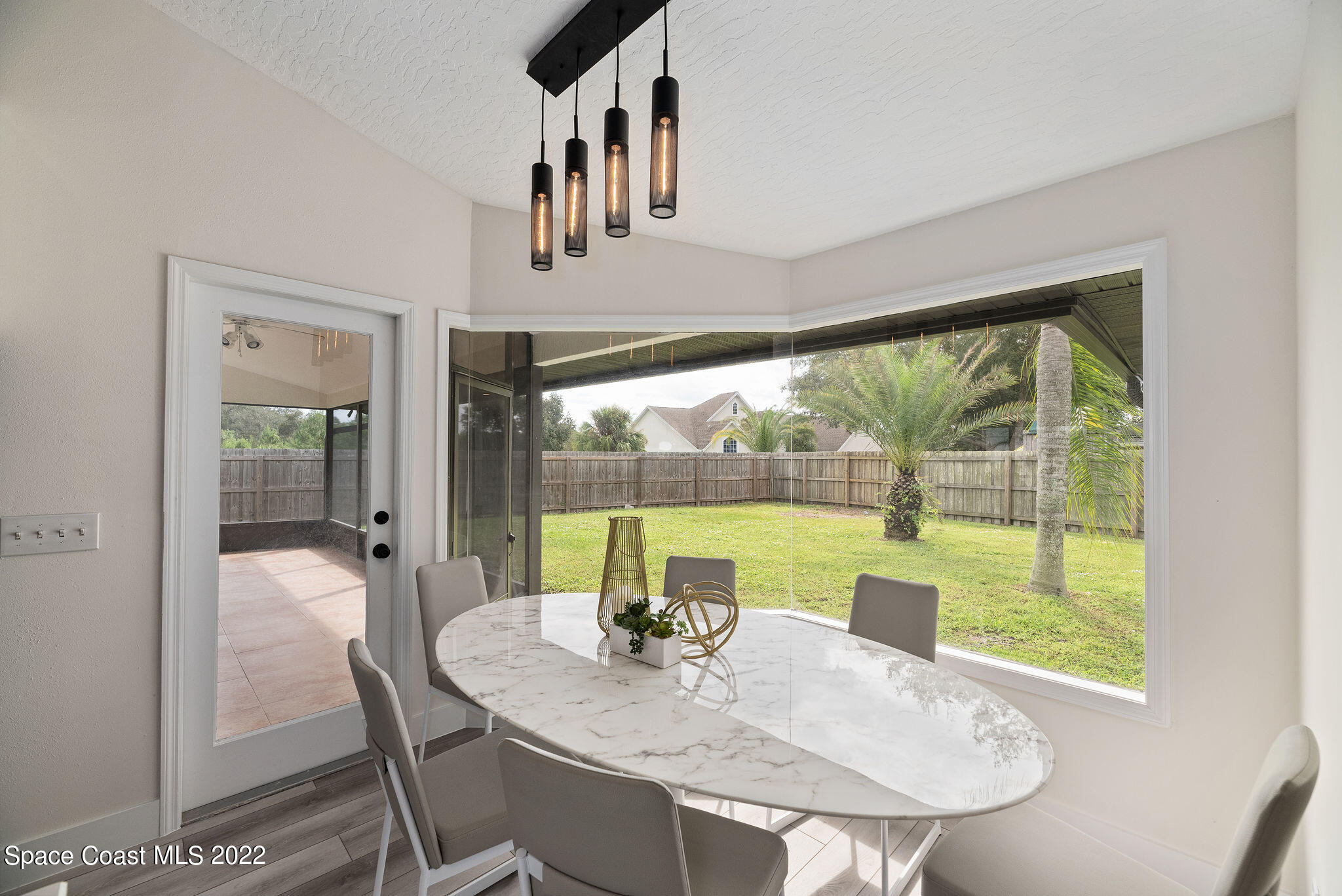 960 Falls Trail Malabar, FL 32950 - Photo 13 of 70 a view of a dining room with furniture window and outside view