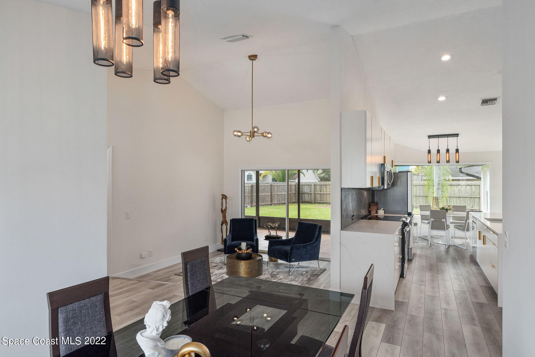 960 Falls Trail Malabar, FL 32950 - Photo 28 of 70 a living room with furniture floor to ceiling window and wooden floor