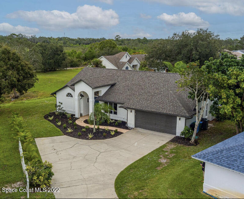 960 Falls Trail Malabar, FL 32950 - Photo 3 of 70 aerial view of a house with a yard and entertaining space