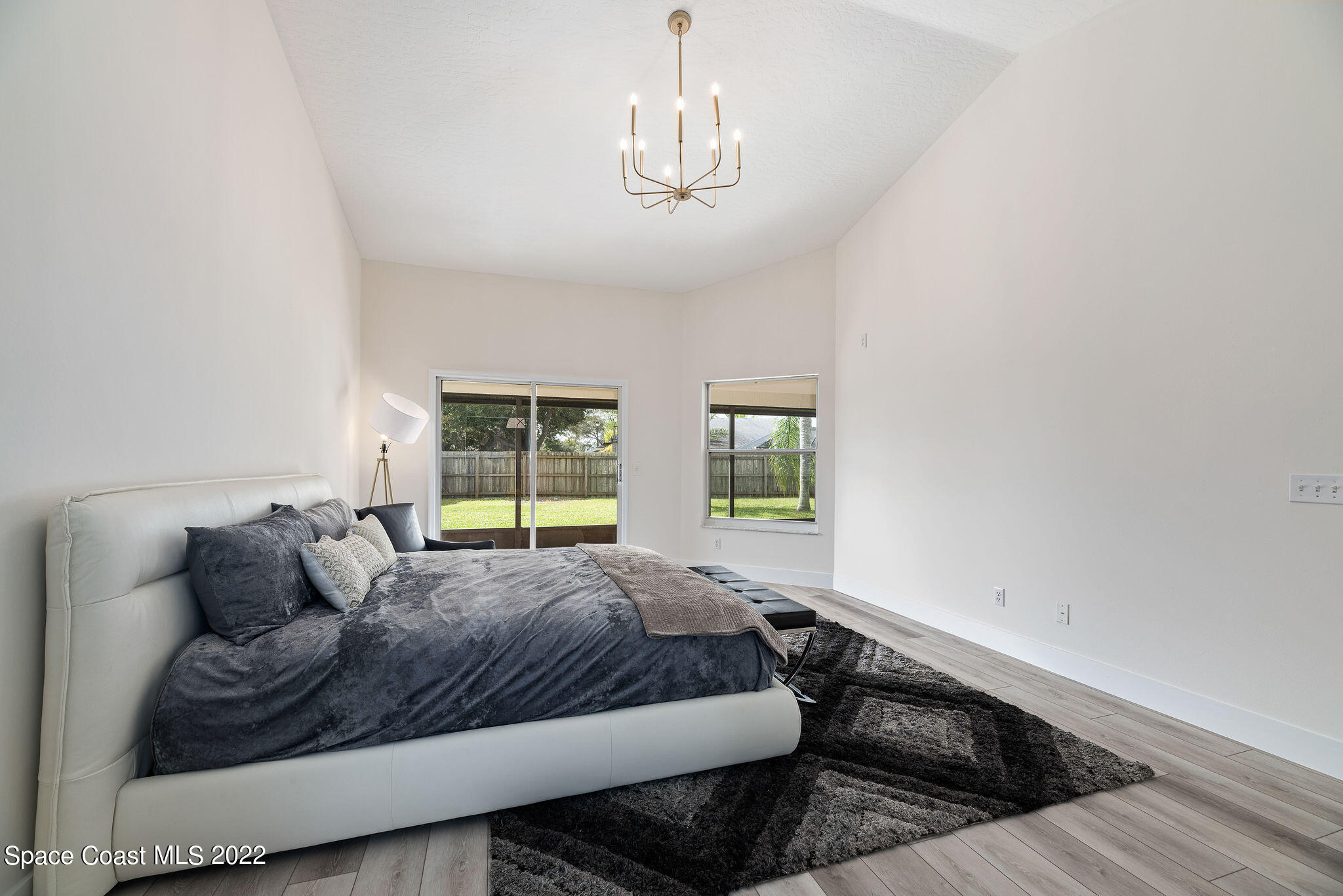 960 Falls Trail Malabar, FL 32950 - Photo 36 of 70 a spacious bedroom with a bed and window