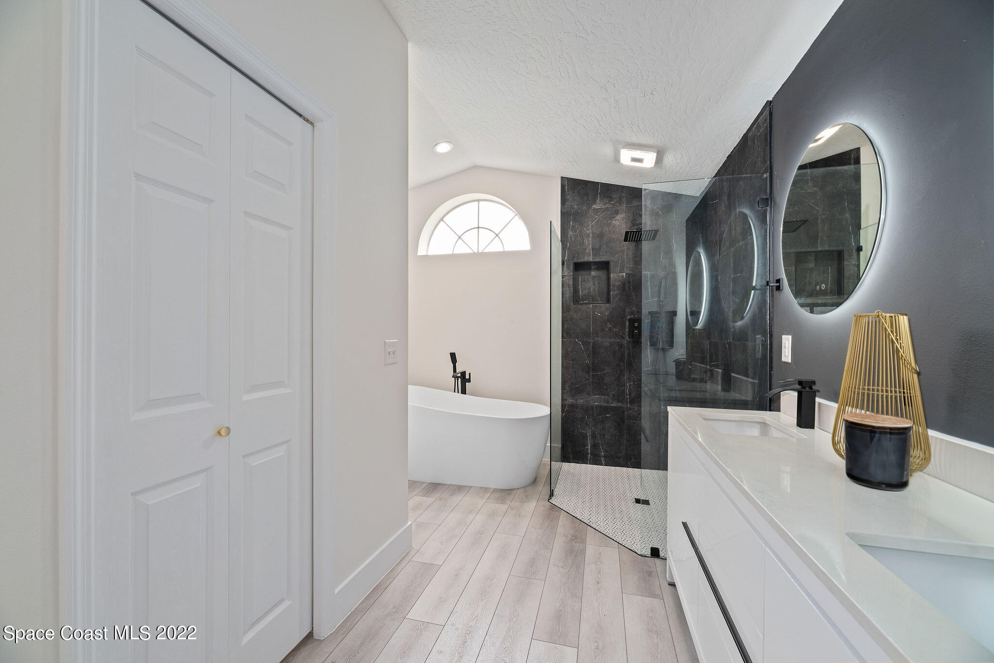 960 Falls Trail Malabar, FL 32950 - Photo 38 of 70 a bathroom with a sink a toilet and a mirror