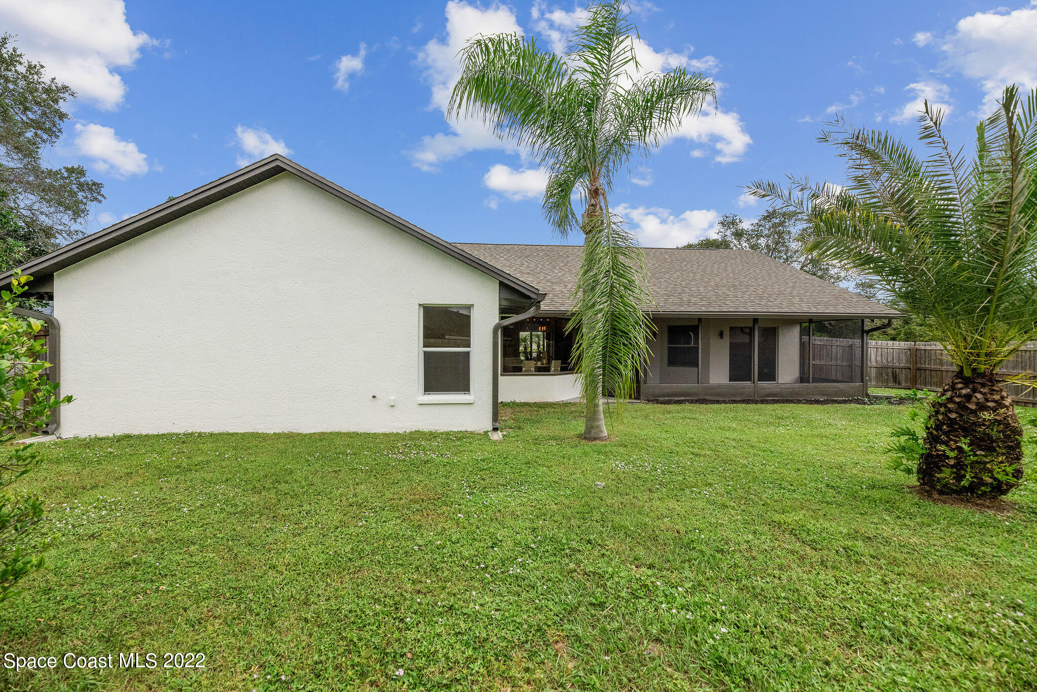 960 Falls Trail Malabar, FL 32950 - Photo 54 of 70 a house that has a tree in front of it