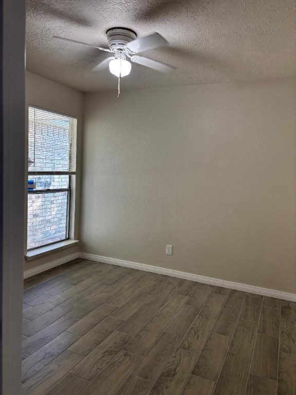 14207 Timberhaven Drive Houston, TX 77066 - Photo 13 of 14 wooden floor in an empty room with a window