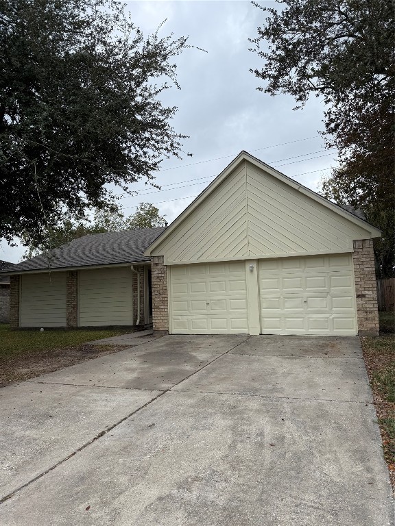 14207 Timberhaven Drive Houston, TX 77066 - Photo 2 of 14 a front view of a house with a yard and garage