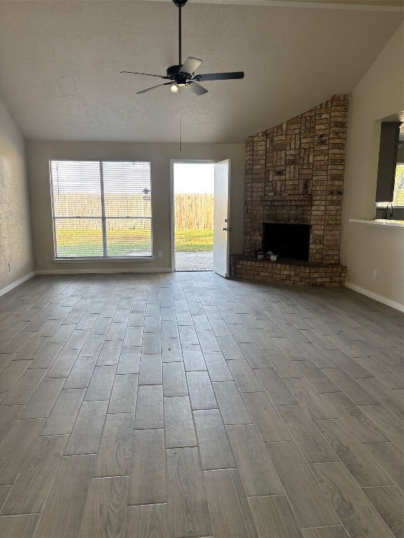 14207 Timberhaven Drive Houston, TX 77066 - Photo 8 of 14 a view of empty room with a fireplace and windows