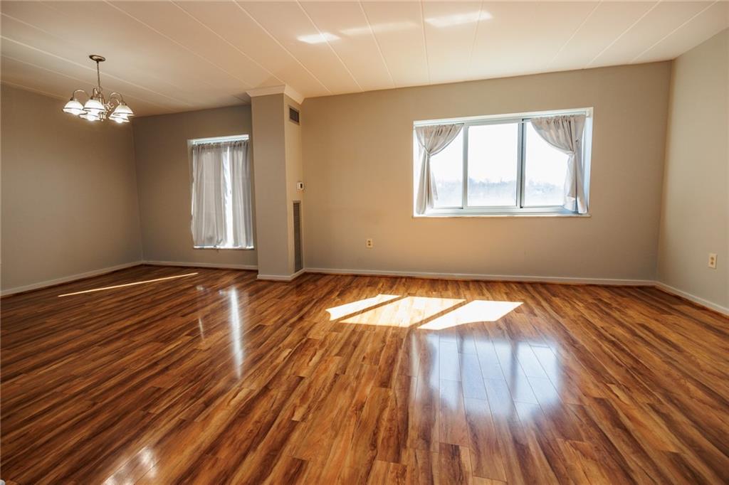 5 Bayard Road, Unit 717 Pittsburgh, PA 15213 - Photo 16 of 46 a view of empty room with wooden floor and fan
