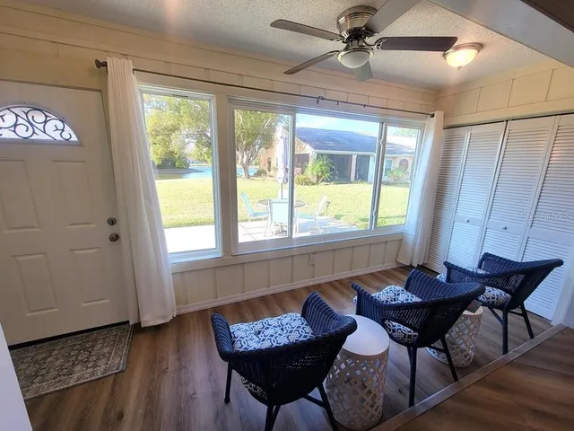 a view of a dining room with furniture window and outside view