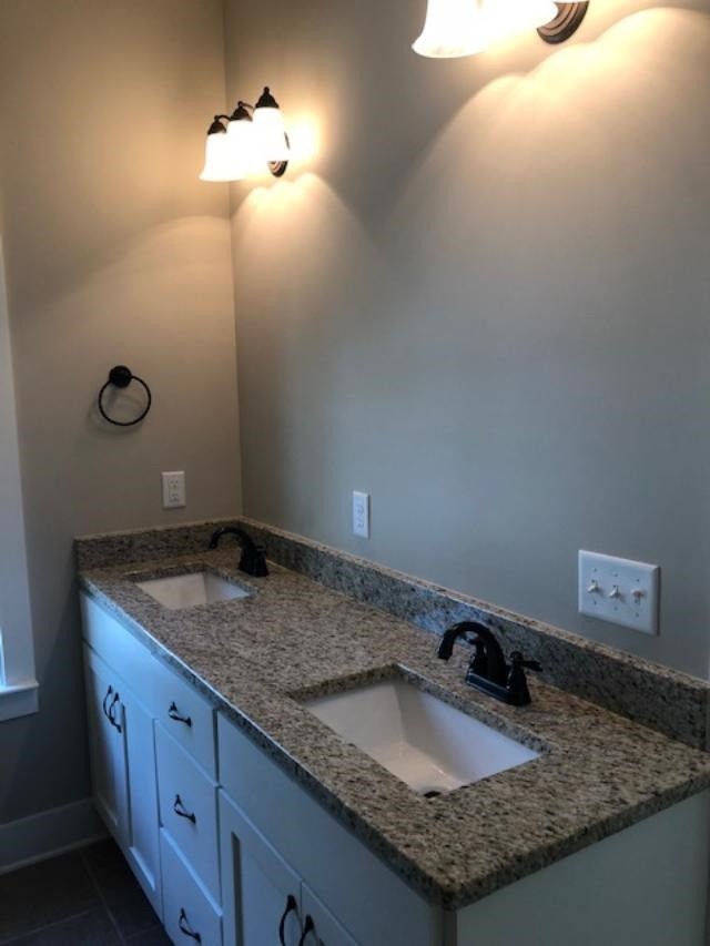 840 Van Davis Road Georgetown, TN 37336 - Photo 20 of 38 a bathroom with a granite countertop sink and a mirror