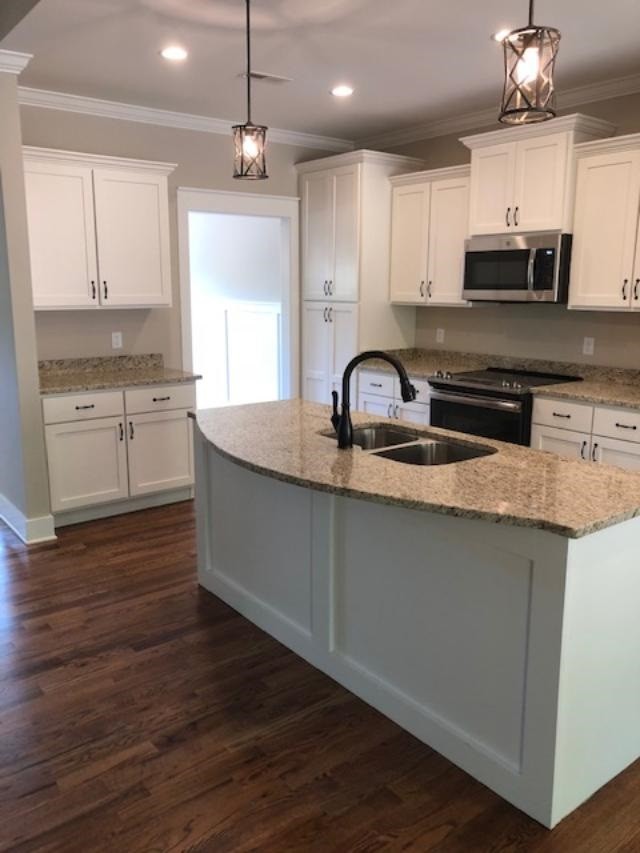 840 Van Davis Road Georgetown, TN 37336 - Photo 3 of 38 a kitchen with kitchen island granite countertop a sink a counter space appliances and cabinets