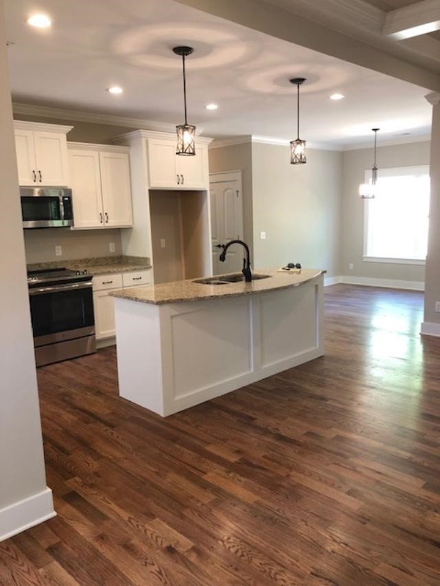 840 Van Davis Road Georgetown, TN 37336 - Photo 8 of 38 a large kitchen with stainless steel appliances granite countertop a sink a stove and a wooden floors