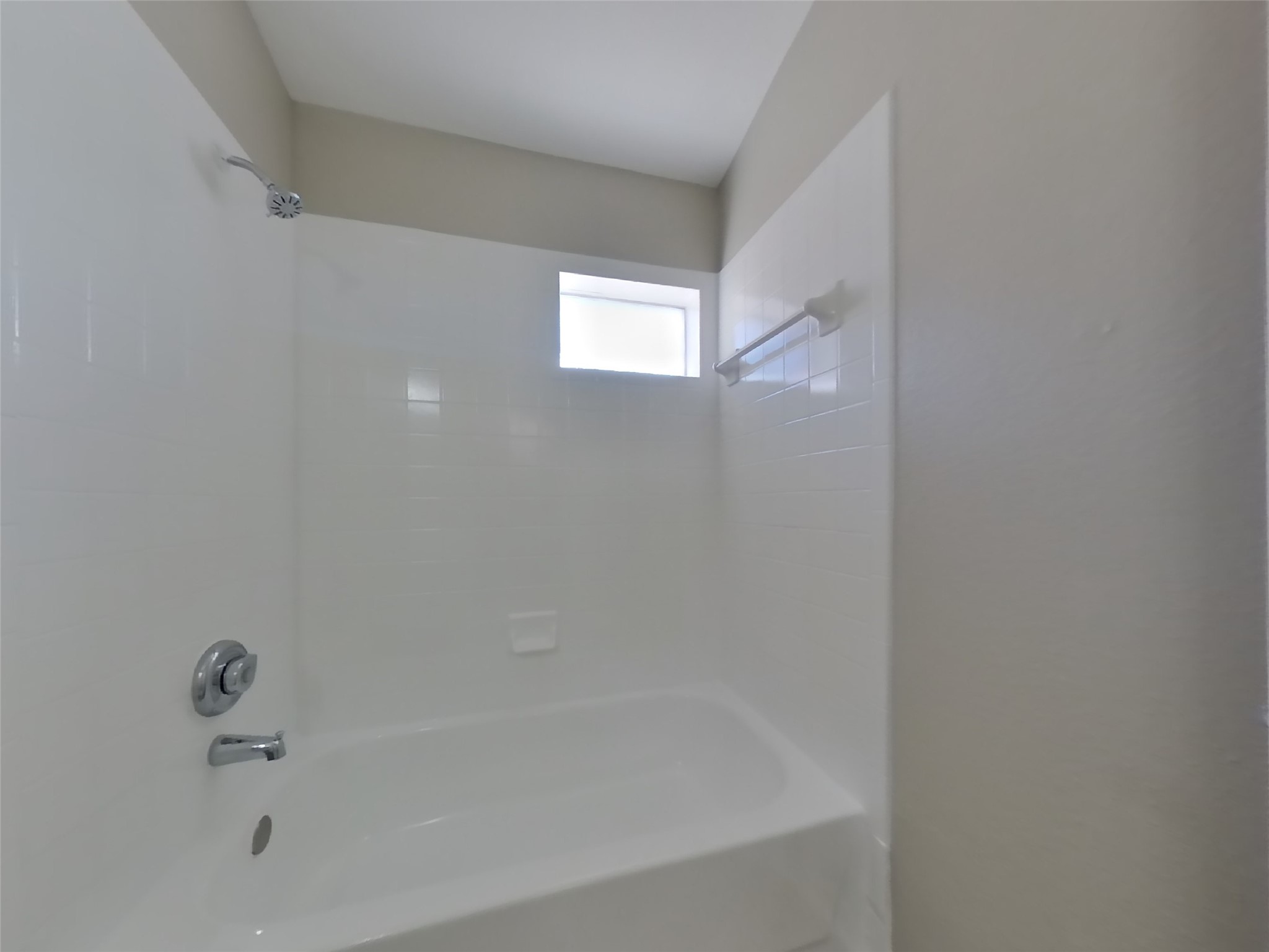 3131 Kelling Street Houston, TX 77045 - Photo 17 of 18 a close up of a bathtub in a bathroom