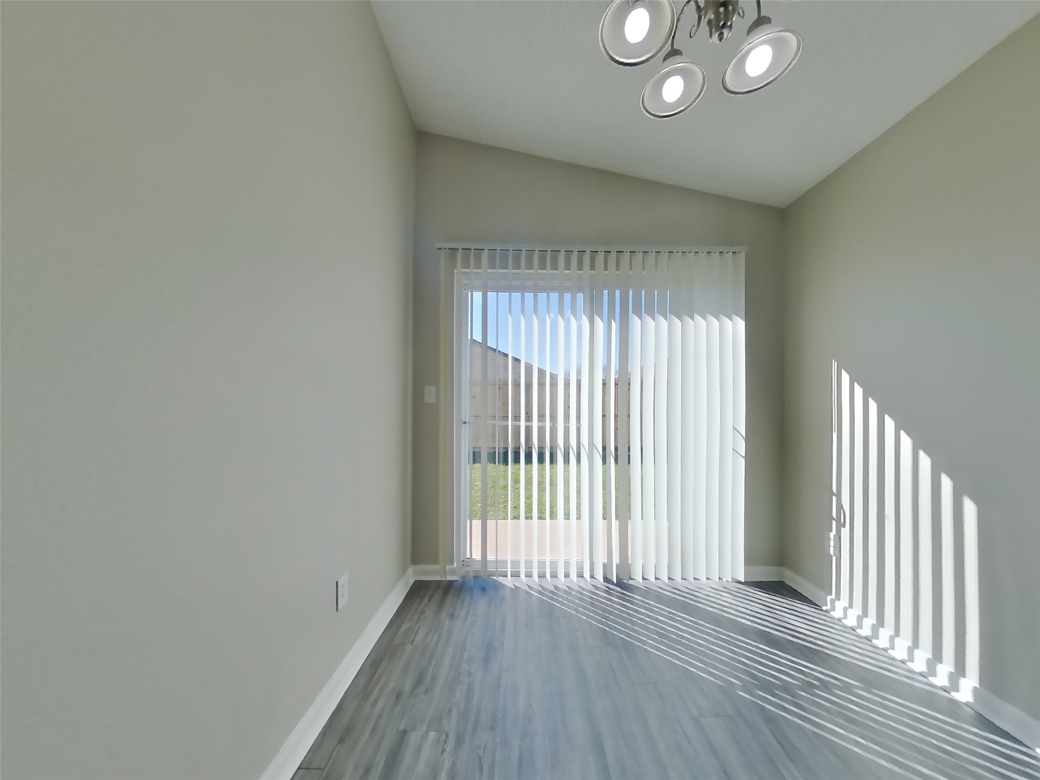 3131 Kelling Street Houston, TX 77045 - Photo 6 of 18 a view of wooden floor and windows in a room