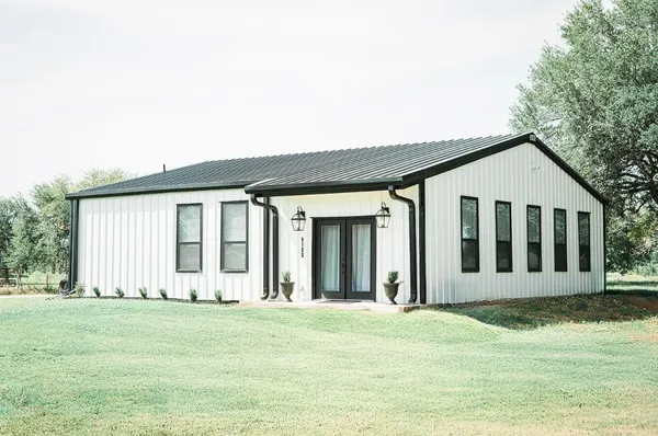 a view of a house with a garden