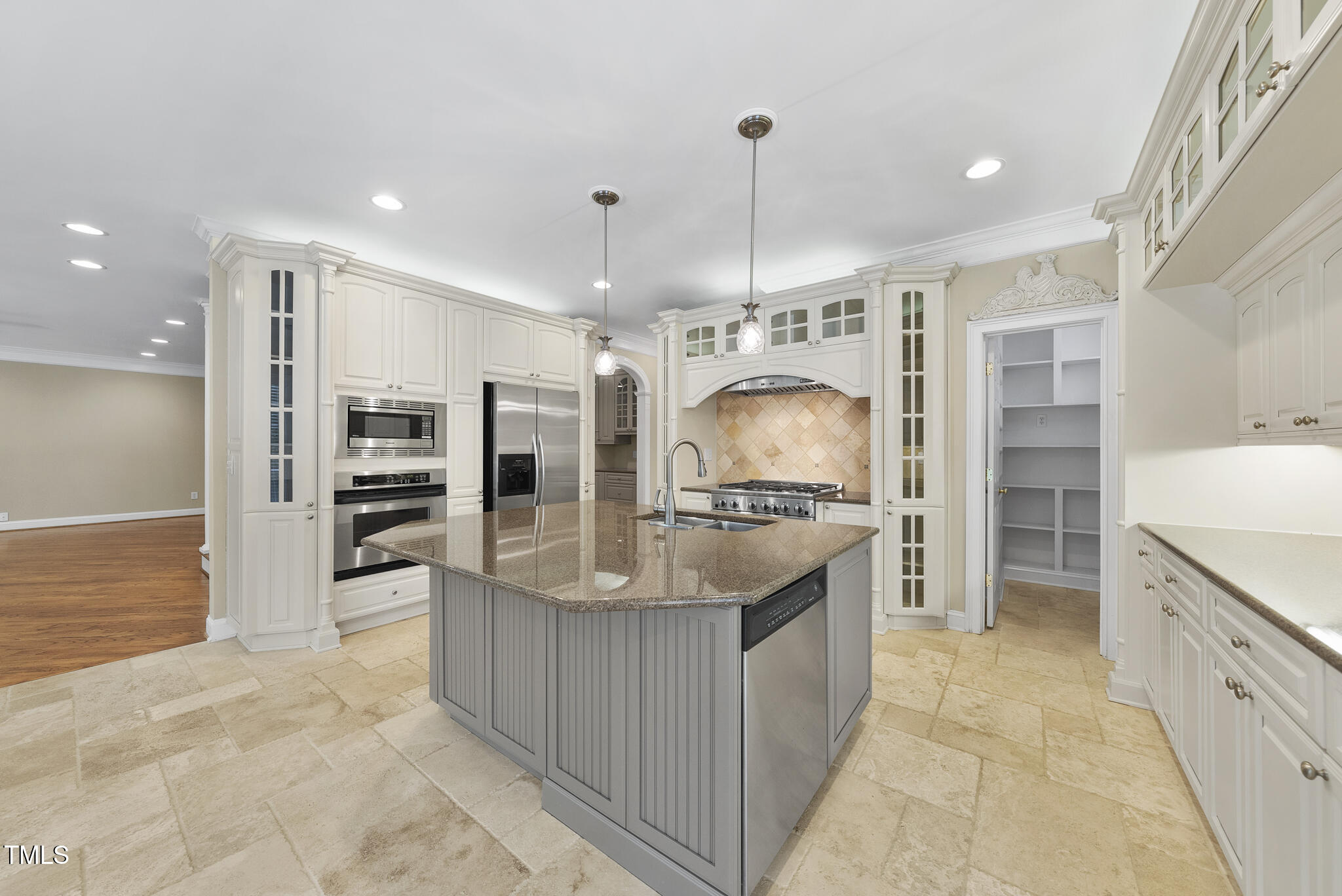 12257 Beestone Lane Raleigh, NC 27614 - Photo 15 of 59 a large kitchen with stainless steel appliances kitchen island granite countertop a refrigerator and a sink