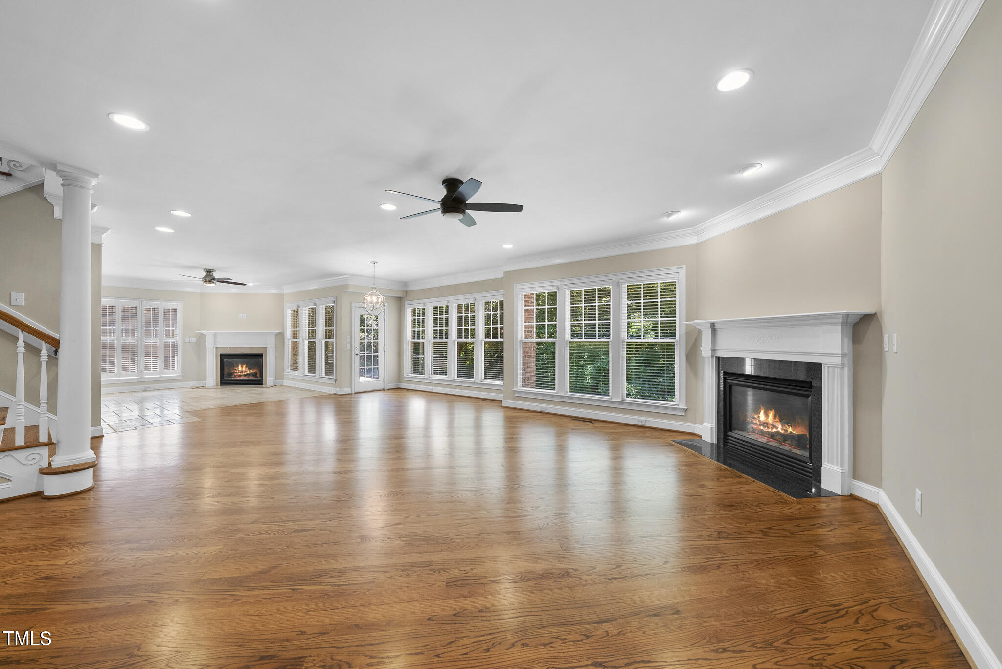 12257 Beestone Lane Raleigh, NC 27614 - Photo 19 of 59 a view of an empty room with wooden floor and a fireplace