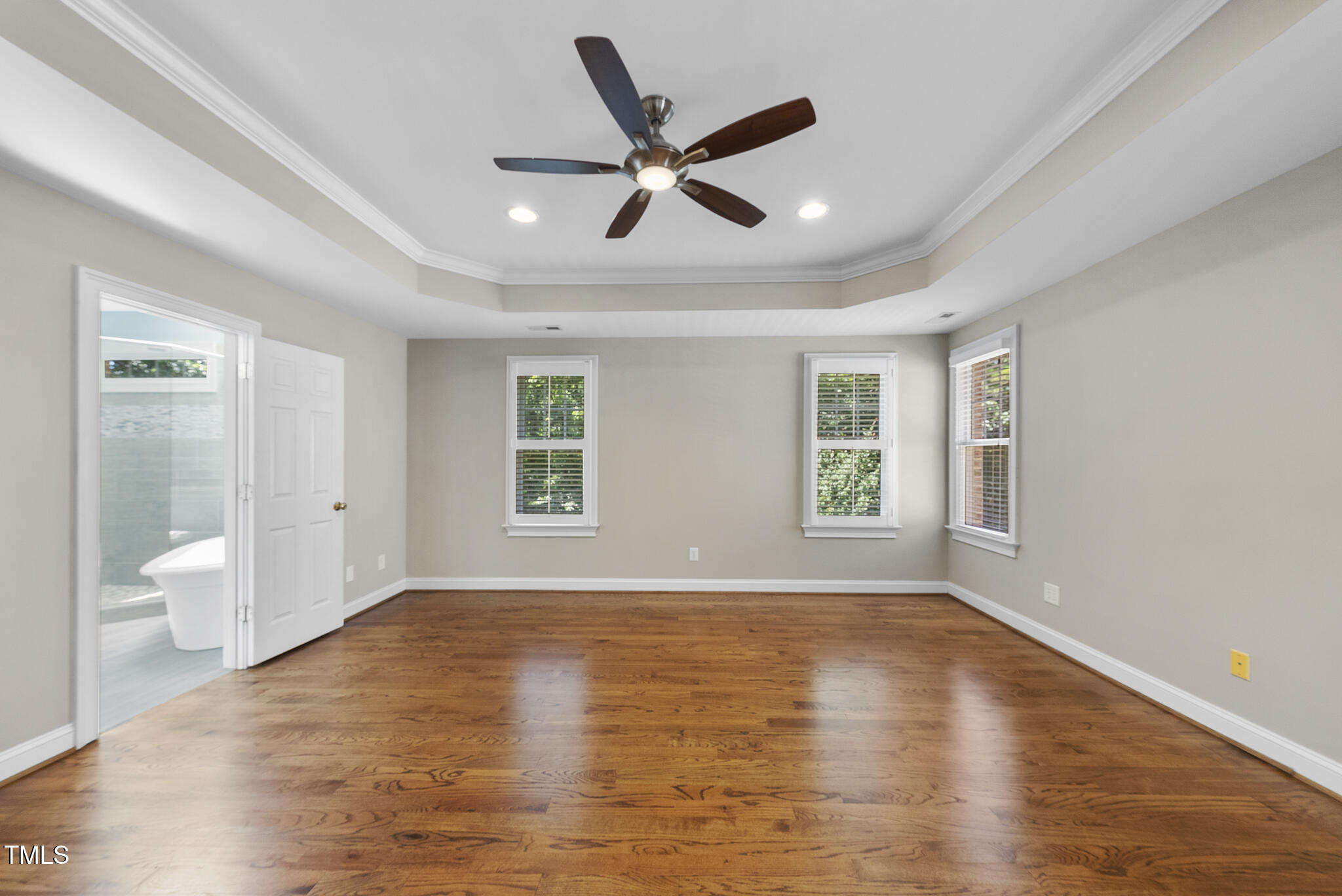 12257 Beestone Lane Raleigh, NC 27614 - Photo 23 of 59 a view of an empty room with wooden floor and a window