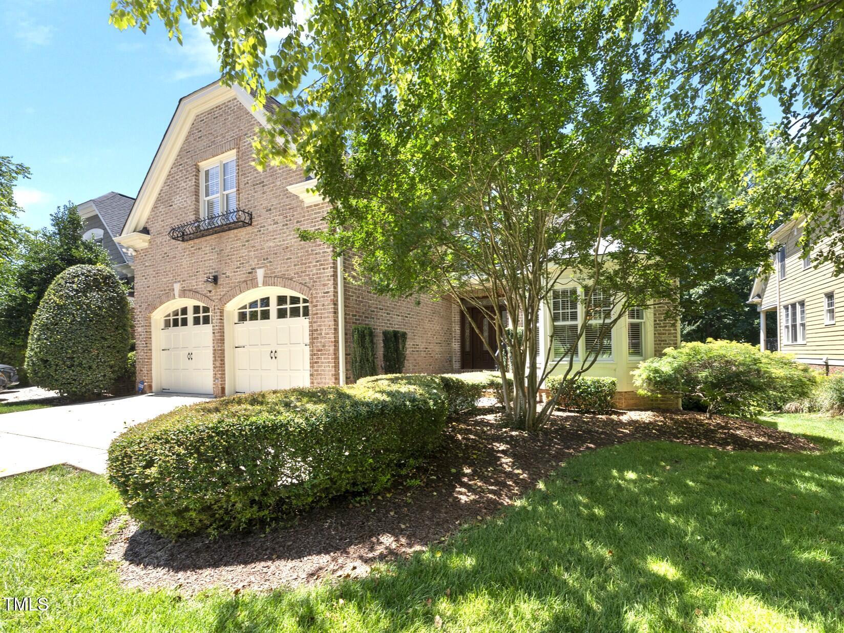 12257 Beestone Lane Raleigh, NC 27614 - Photo 2 of 59 a front view of a house with garden