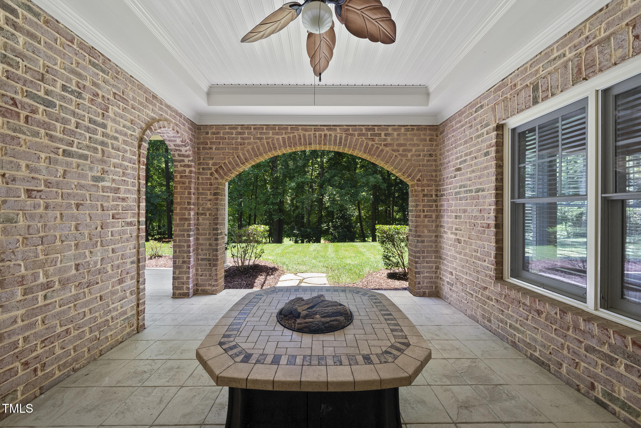 12257 Beestone Lane Raleigh, NC 27614 - Photo 48 of 59 a view of a porch with furniture and floor to ceiling window